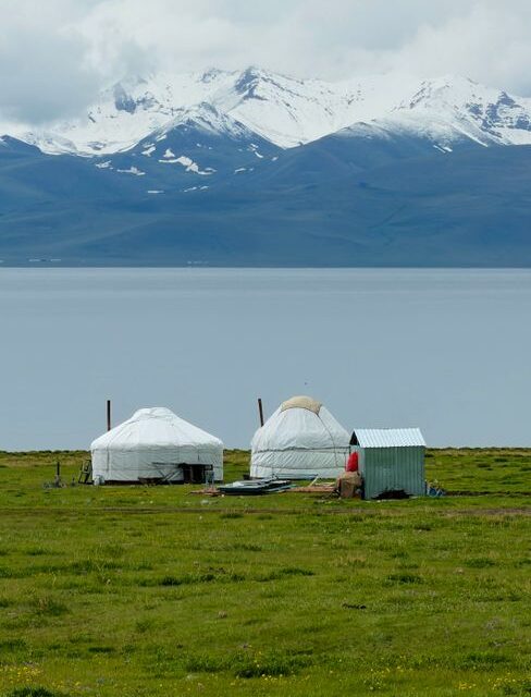 Yurt camp beside an alpine lake in Kyrgyzstan